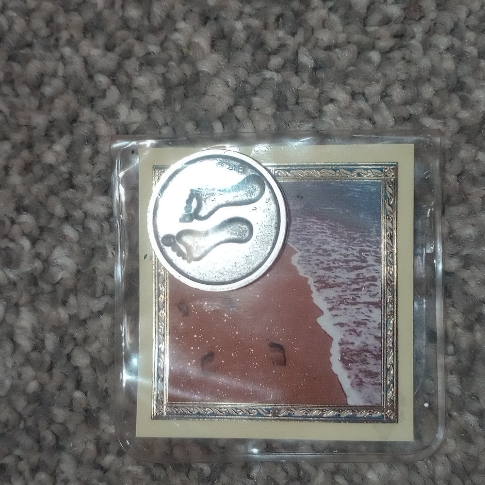 Italy marked 925 silver footprints coin.